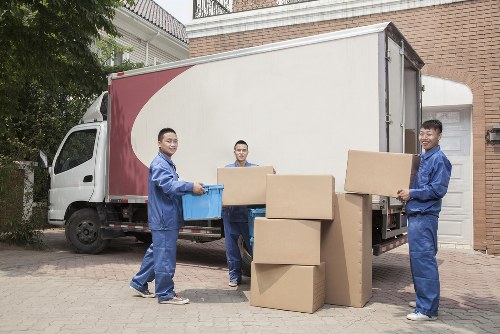 Removal van and moving boxes representing booked moving services