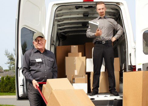Crew providing furniture pick-up in Richmond for a large sofa
