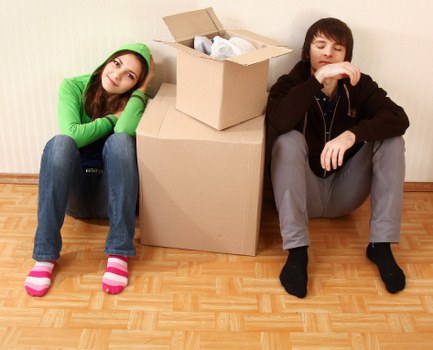 Moving team navigating stairs during a flat relocation in Richmond