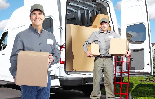 Packing boxes and furniture into a moving truck in Richmond