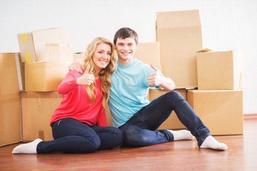 Family moving boxes during residential removals in Richmond
