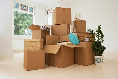 Professional movers carrying furniture during a Richmond house relocation